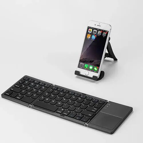 Teclado Bluetooth Plegable Ultra Delgado – Tu Oficina Portátil en la Palma de tu Mano ⌨🖱